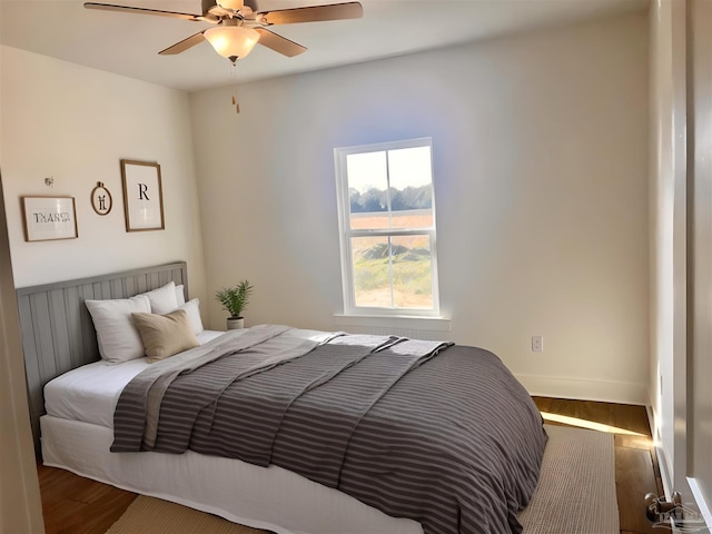 4420 Russell Elliott Rd, Jay, FL 32565 - bedroom with wood finished floors, ceiling fan, and baseboards