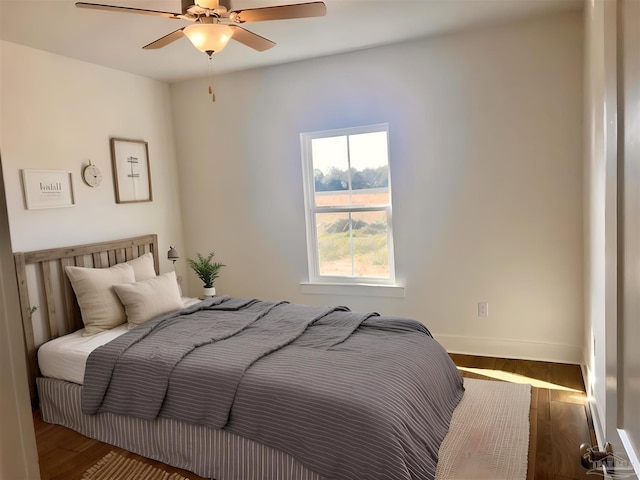 4420 Russell Elliott Rd, Jay, FL 32565 - bedroom with baseboards, wood finished floors, and ceiling fan