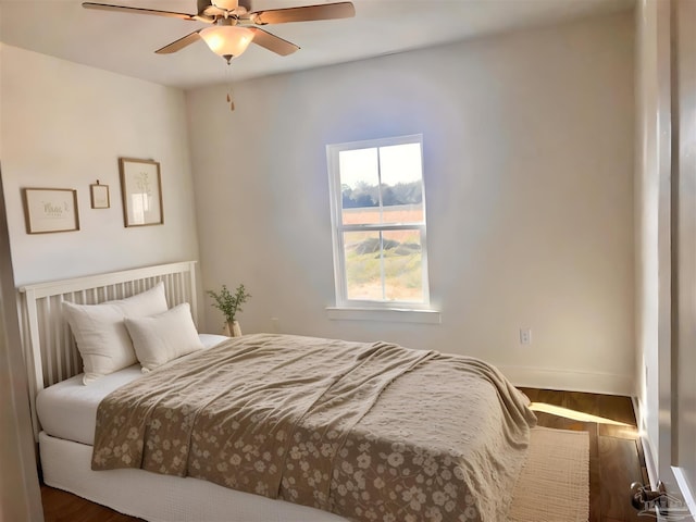 4420 Russell Elliott Rd, Jay, FL 32565 - bedroom featuring wood finished floors, baseboards, and ceiling fan
