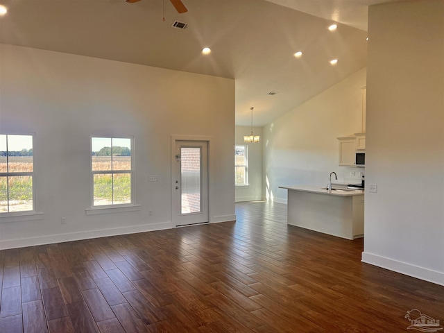 4420 Russell Elliott Rd, Jay, FL 32565 - unfurnished living room featuring a sink, high vaulted ceiling, a ceiling fan, a chandelier, and dark wood-style floors