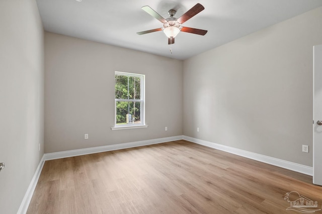 4420 Russell Elliott Rd, Jay, FL 32565 - spare room featuring light wood-type flooring, a ceiling fan, and baseboards