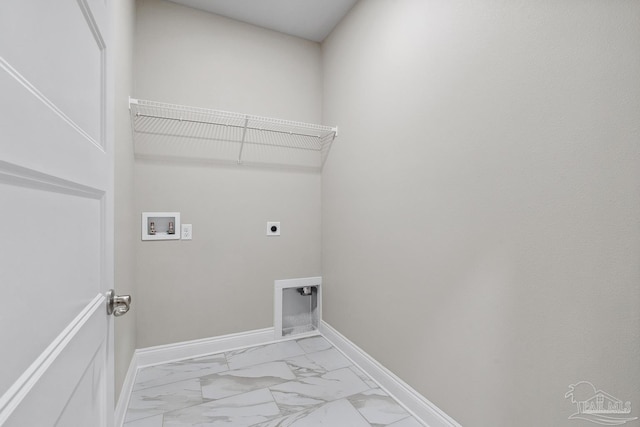 4420 Russell Elliott Rd, Jay, FL 32565 - laundry room featuring hookup for an electric dryer, marble look tiles, hookup for a washing machine, and baseboards