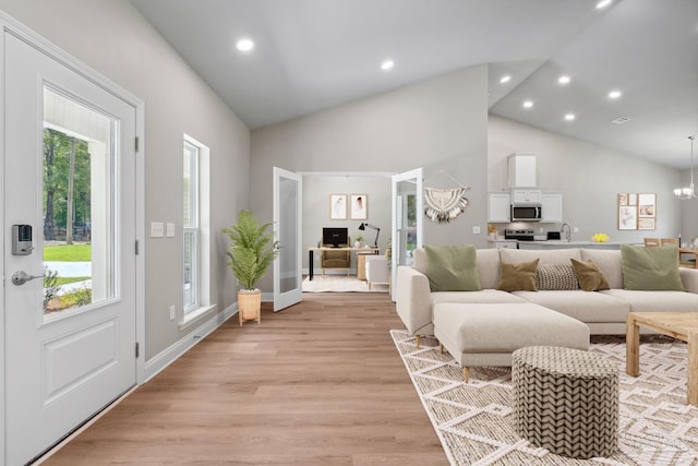 4420 Russell Elliott Rd, Jay, FL 32565 - living area featuring recessed lighting, high vaulted ceiling, light wood-type flooring, an office area, and a chandelier
