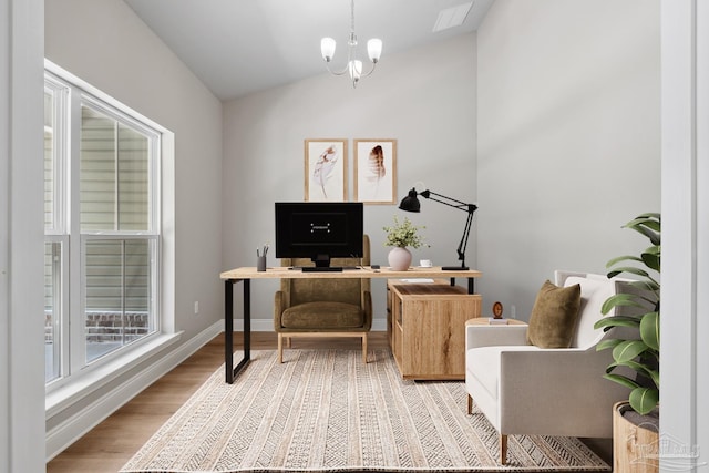 4420 Russell Elliott Rd, Jay, FL 32565 - office with lofted ceiling, light wood-type flooring, a chandelier, and baseboards