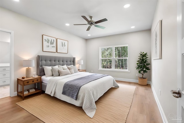 4420 Russell Elliott Rd, Jay, FL 32565 - bedroom featuring light wood finished floors, baseboards, recessed lighting, a ceiling fan, and ensuite bath
