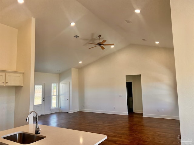 4420 Russell Elliott Rd, Jay, FL 32565 - kitchen featuring a sink, open floor plan, dark wood finished floors, high vaulted ceiling, and recessed lighting
