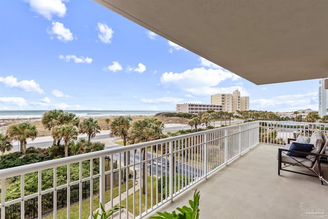 balcony with a view of the beach and a water view