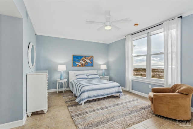 bedroom with ceiling fan, multiple windows, and ornamental molding