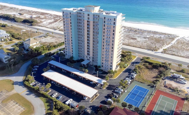 bird's eye view with a water view and a beach view