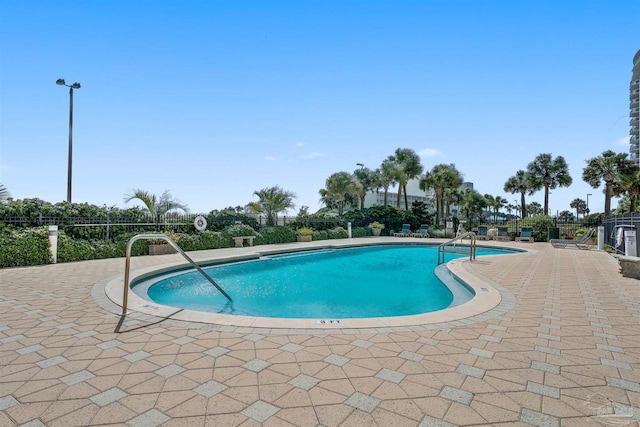 view of pool featuring a patio