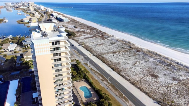 bird's eye view with a beach view and a water view