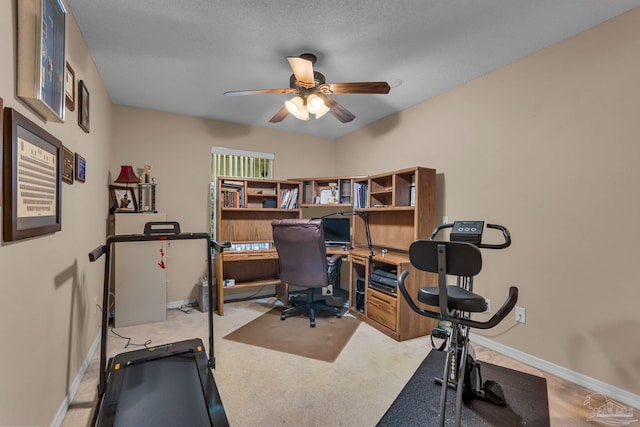 office space with light carpet and ceiling fan