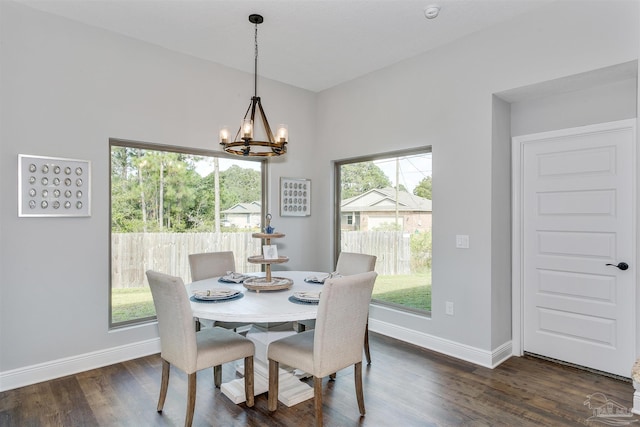 6610 Delhi Dr, Milton, FL 32583 - dining area with a chandelier, healthy amount of natural light, and dark wood-type flooring