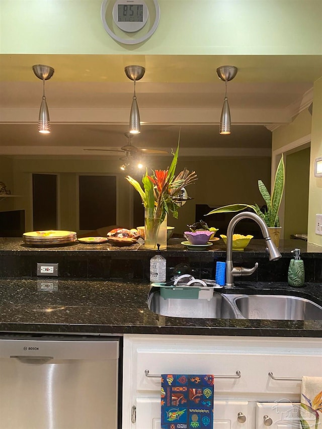 kitchen featuring dishwasher, hanging light fixtures, and white cabinetry