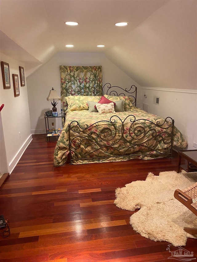 bedroom with dark hardwood / wood-style floors and vaulted ceiling