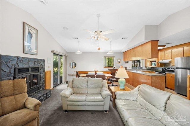1948 Tanbark Dr, Milton, FL 32583 - living room featuring plenty of natural light, light colored carpet, ceiling fan, and high vaulted ceiling