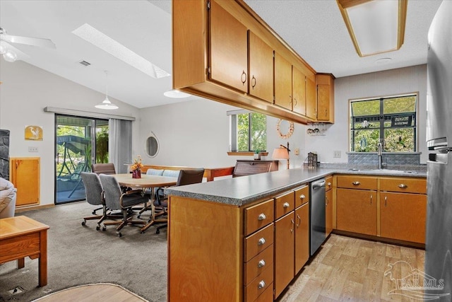 1948 Tanbark Dr, Milton, FL 32583 - kitchen featuring a skylight, stainless steel appliances, healthy amount of natural light, a peninsula, and lofted ceiling