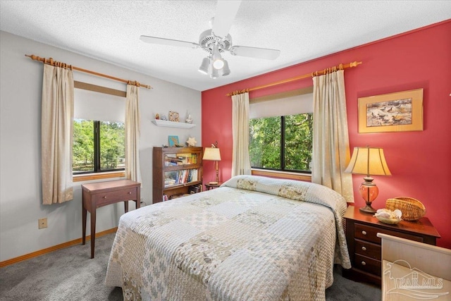 1948 Tanbark Dr, Milton, FL 32583 - bedroom with carpet floors, baseboards, a textured ceiling, and ceiling fan