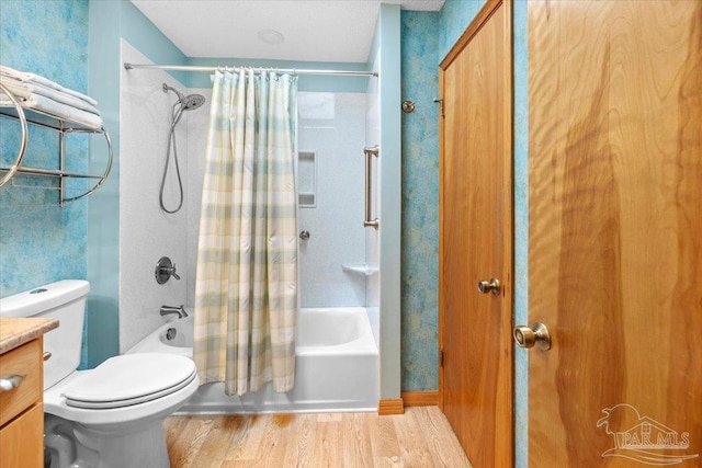 1948 Tanbark Dr, Milton, FL 32583 - full bathroom featuring wood finished floors, shower / bath combination with curtain, toilet, and vanity