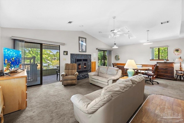 1948 Tanbark Dr, Milton, FL 32583 - carpeted living area with vaulted ceiling, healthy amount of natural light, and ceiling fan