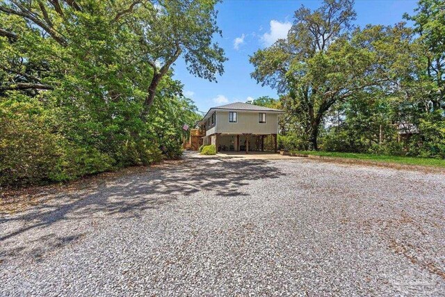 1948 Tanbark Dr, Milton, FL 32583 - view of front facade featuring driveway and a carport
