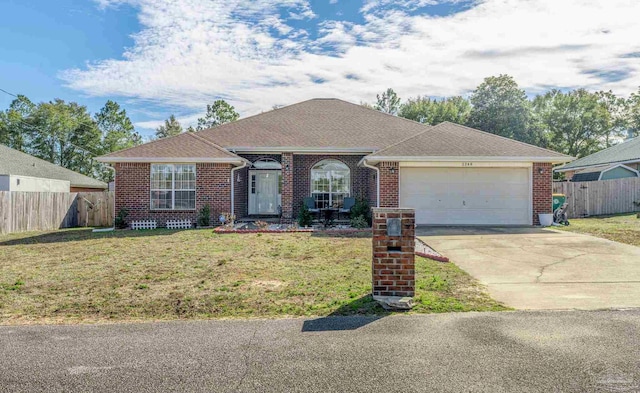 ranch-style house featuring a front lawn and a garage