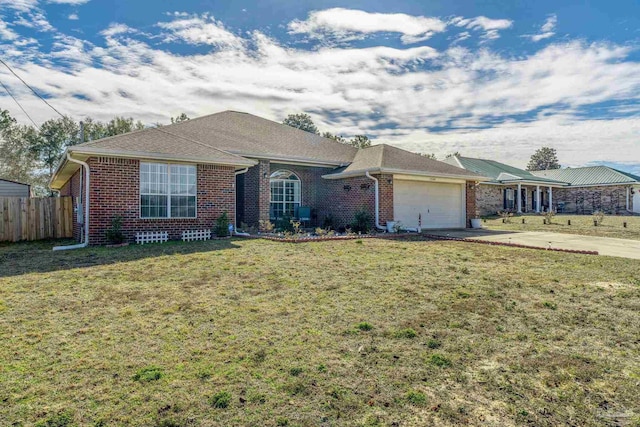 single story home featuring a front yard and a garage