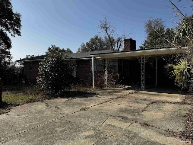 exterior space featuring a carport