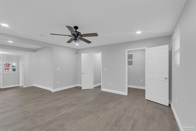 interior space with light wood-type flooring and ceiling fan