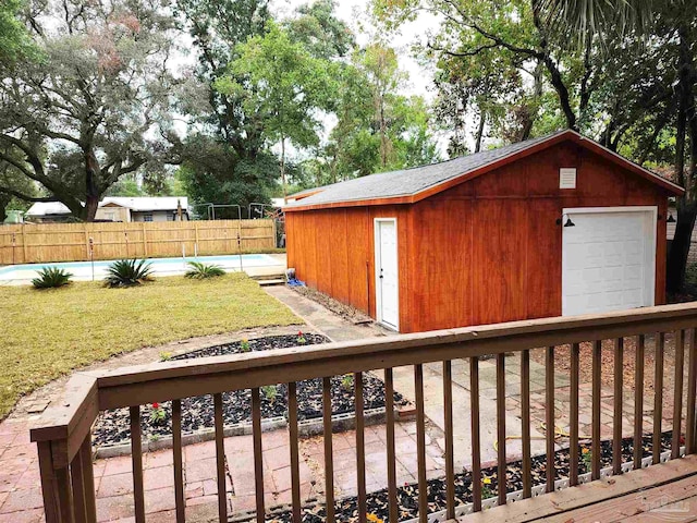 exterior space featuring an outbuilding, a garage, and a yard