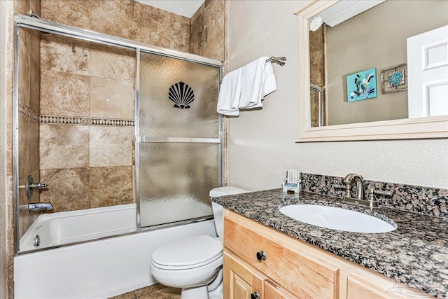 1150 Ft Pickens Rd Unit C7, Pensacola Beach, FL 32561 - full bathroom featuring bath / shower combo with glass door, vanity, and toilet