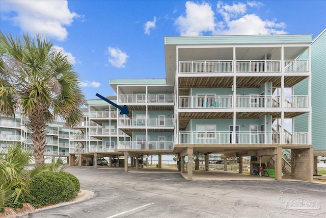 1150 Ft Pickens Rd Unit C7, Pensacola Beach, FL 32561 - view of apartment building / complex with covered parking