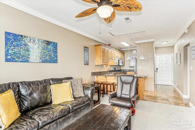 1150 Ft Pickens Rd Unit C7, Pensacola Beach, FL 32561 - living room featuring a ceiling fan, ornamental molding, rail lighting, baseboards, and light tile patterned floors