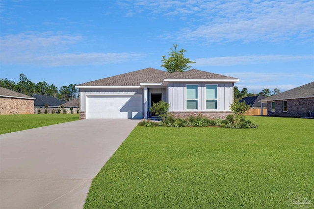 6329 Buckthorn Cir Lot 22E, Pace, FL 32571 - ranch-style home with board and batten siding, a garage, driveway, and a front lawn