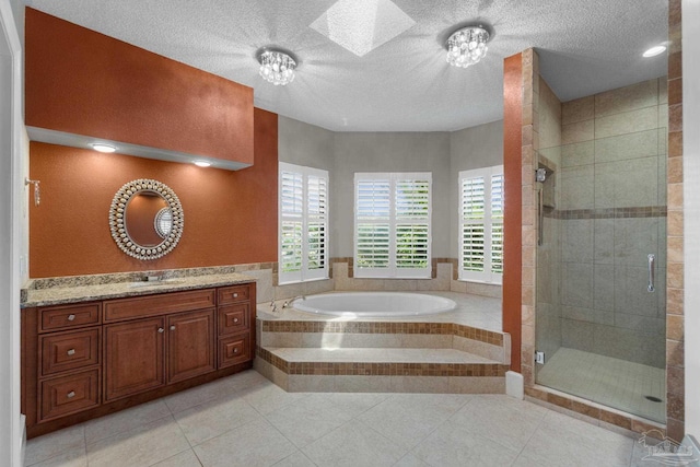 2715 Masters Blvd, Navarre, FL 32566 - full bathroom with a bath, a shower stall, vanity, tile patterned flooring, and a textured ceiling