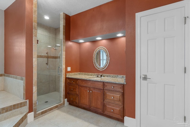 2715 Masters Blvd, Navarre, FL 32566 - full bath featuring tile patterned floors, a shower stall, vanity, a textured ceiling, and recessed lighting