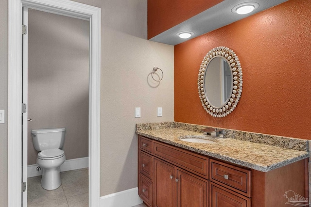 2715 Masters Blvd, Navarre, FL 32566 - bathroom with vanity, tile patterned floors, and a textured wall