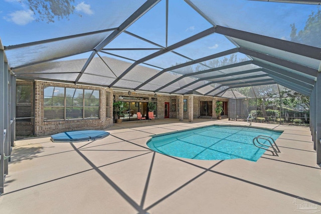 2715 Masters Blvd, Navarre, FL 32566 - outdoor pool with a patio area and glass enclosure