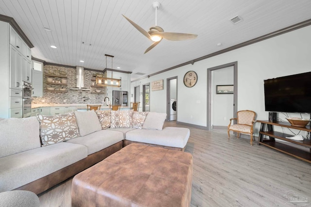 7730 Sunfish Ln, Milton, FL 32583 - living area featuring crown molding, wood ceiling, light wood-style floors, ceiling fan, and visible vents