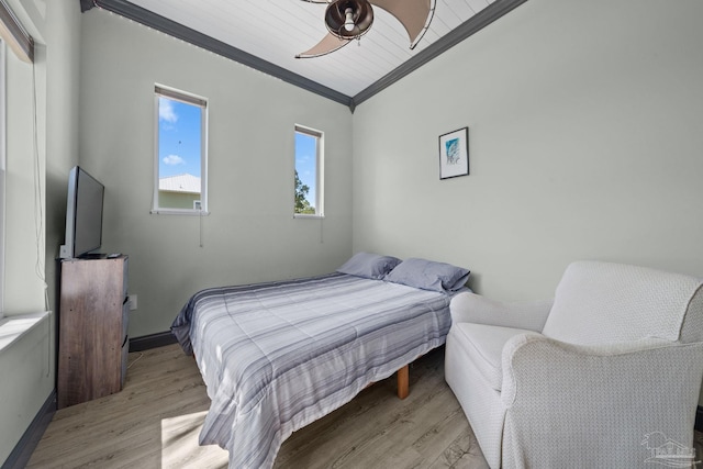 7730 Sunfish Ln, Milton, FL 32583 - bedroom featuring baseboards, light wood-type flooring, and crown molding
