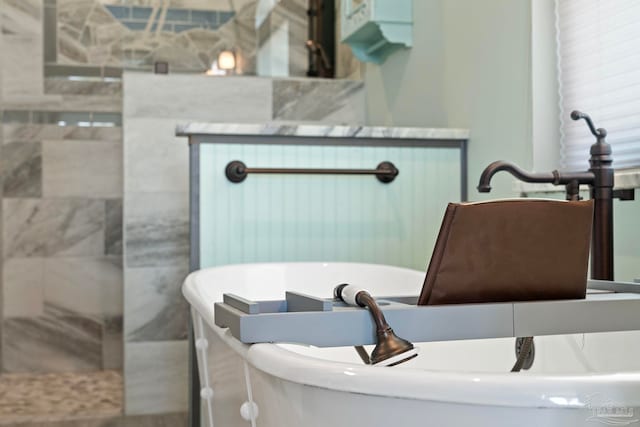 7730 Sunfish Ln, Milton, FL 32583 - bathroom with a freestanding tub and walk in shower