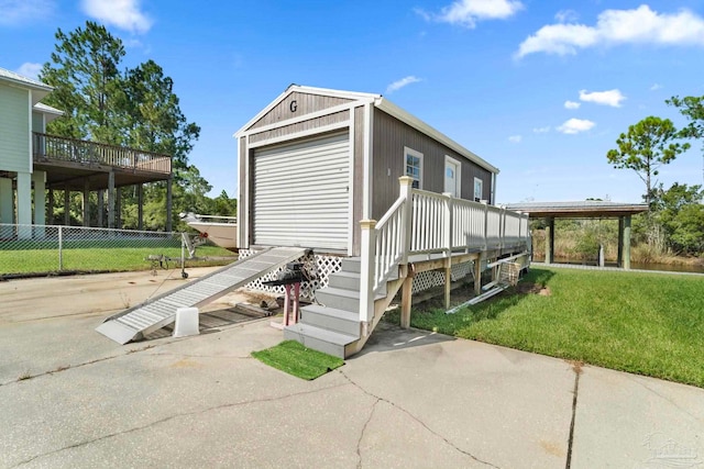 7730 Sunfish Ln, Milton, FL 32583 - exterior space featuring fence and an outdoor structure
