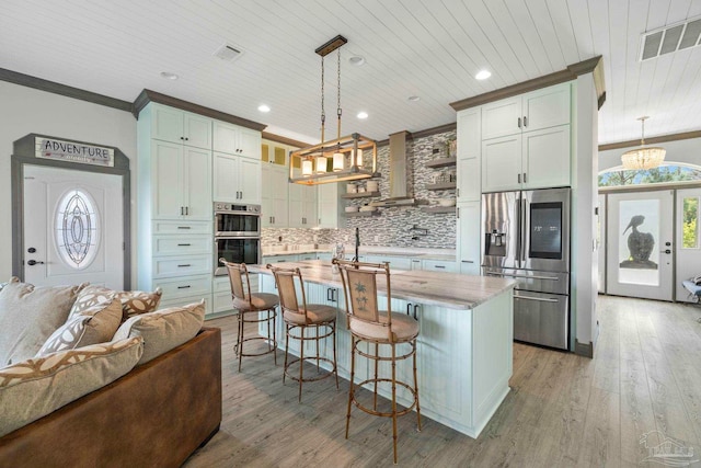 7730 Sunfish Ln, Milton, FL 32583 - kitchen featuring tasteful backsplash, ornamental molding, wooden ceiling, visible vents, and appliances with stainless steel finishes