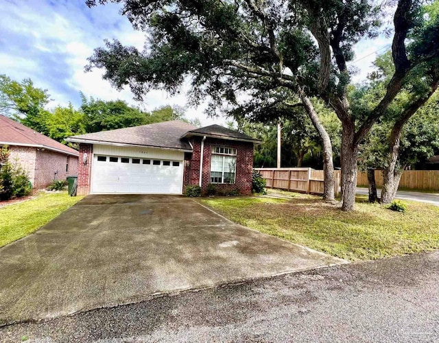 ranch-style home with a garage and a front yard