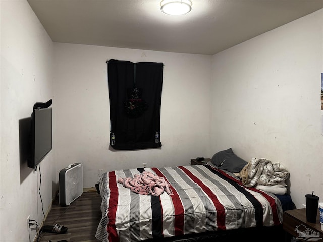 bedroom featuring dark hardwood / wood-style floors