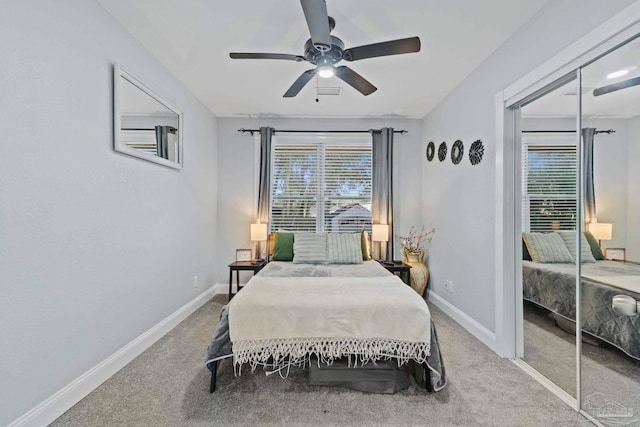 bedroom with carpet floors, ceiling fan, and a closet