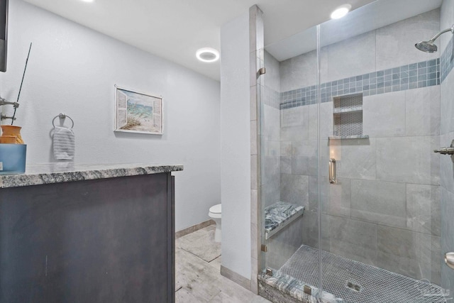 bathroom featuring walk in shower, vanity, toilet, and hardwood / wood-style flooring