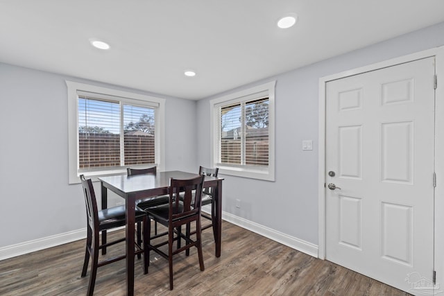 dining room with dark hardwood / wood-style flooring