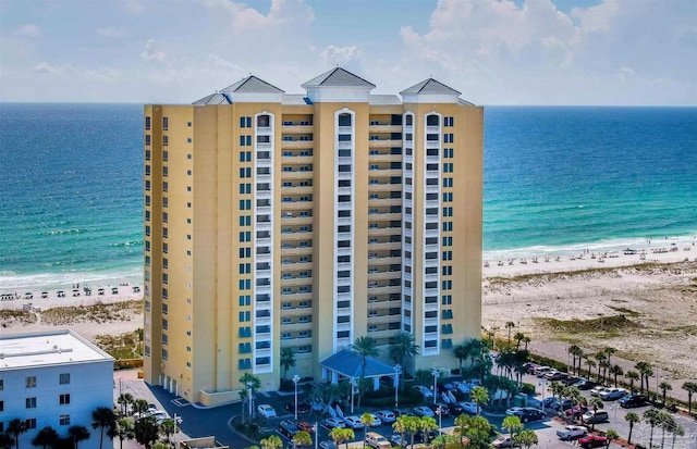 exterior space featuring a view of the beach and a water view