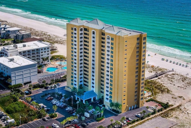 bird's eye view with a beach view and a water view